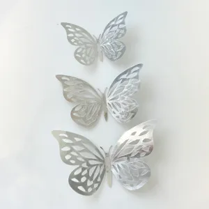 Close-up of silver hollow butterfly cake toppers for birthday party and mother's day.