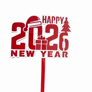 Red acrylic 2026 New Year cake topper detail shot, festive holiday party decoration.