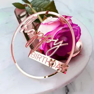 Rose gold acrylic happy birthday cake topper, elegant party decoration for celebration.