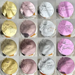 Acrylic mirror cake topper detail with engraved floral patterns and festive text options.