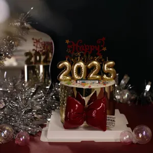 New Year 2025 cake topper set with gold number candles and red bow for party decoration.