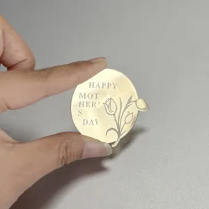 Gold acrylic Happy Mother's Day cake topper detail, elegant floral engraved dessert decoration.