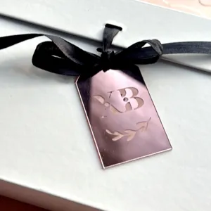 Acrylic ribbon pendant with black bow and rose gold tag for Easter cake decoration gift.