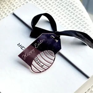 Easter acrylic ribbon pendant cake decoration detail, stylish festive party accessory.