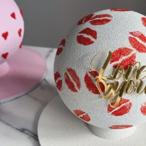 Gold acrylic Love You cake topper detail close up, perfect for Valentine Day desserts.