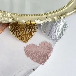 Heart acrylic cake topper detail shot in gold silver rose gold colors for romantic celebrations.
