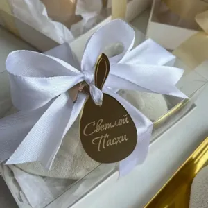 Easter bunny acrylic cake topper golden egg charm with white ribbon gift box detail.