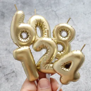 Gold balloon number candles for birthday cakes, party decorations and New Year celebrations.