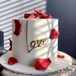 Valentine day acrylic love cake topper with red rose petals for romantic party decoration style.