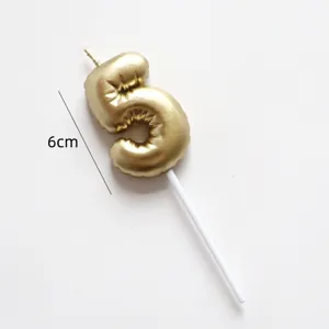 Gold number 5 foil balloon style birthday cake candle close-up showing 6cm height and stick.