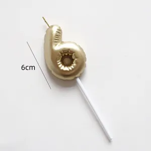 Gold number 6 balloon candle cake topper closeup detail, perfect for birthday party decor.
