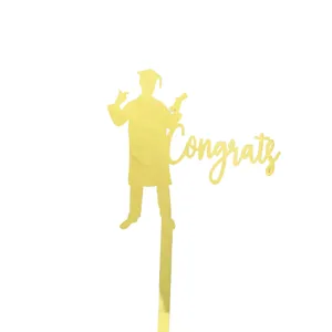 Gold acrylic graduation cake topper with Congrats lettering for grad party celebration decor.
