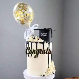 Graduation cake topper set with congrats sign and 2023 cap for party decoration details