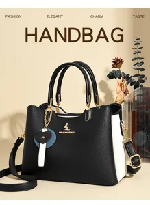 Stylish women colorblock handbag with elegant metal charm, top handle and shoulder strap.