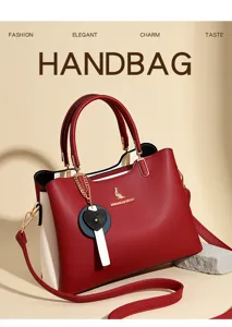 Stylish women color block handbag with strap and heart charm elegant tote bag for daily use.