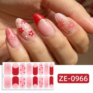 New Year nail stickers featuring red pink gradient, gold glitter fireworks and floral designs.