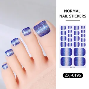 Detailed view of stunning blue gradient glitter toenail stickers with shiny cat-eye effect.