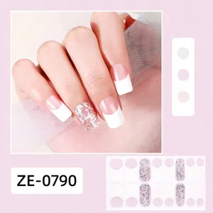 Detailed close-up of French white tip nail wraps with sparkly glitter accents and sheet display.