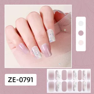 Detail view of gradient pink nail wraps with holographic glitter, elegant sticker sheet.