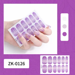 Purple polka dot nail wraps detail view, featuring gradient glitter finish for trendy nail art.