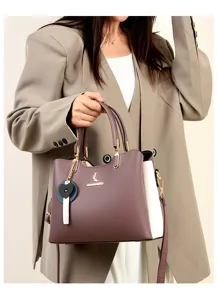 Stylish women's color-block handbag tote shoulder crossbody bag with heart charm.