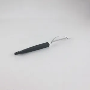 Stainless steel fruit peeler with ergonomic black and white handle for kitchen use.
