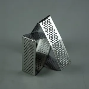 Stainless steel perforated tart ring detail shot, showing precise micro-holes for even baking.