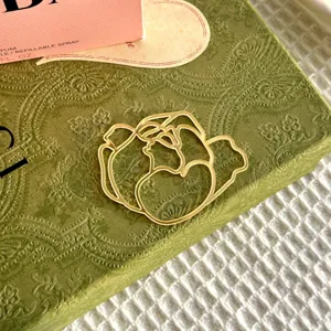 Gold hollow flower cake topper detail shot, elegant floral acrylic decoration for Mother's Day baking.