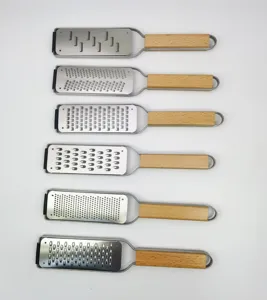 Stainless steel cheese grater set with wood handles for lemon zest and chocolate grating.