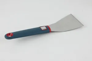Stainless steel kitchen spatula with blue and red silicone handle detail view, durable tool.
