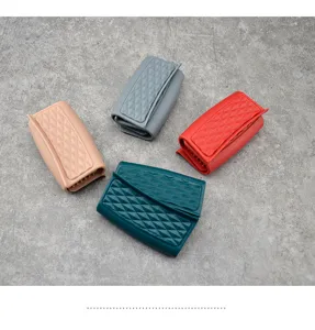 Silicone anti-scald pot clips in four colors, featuring diamond texture for kitchen use.