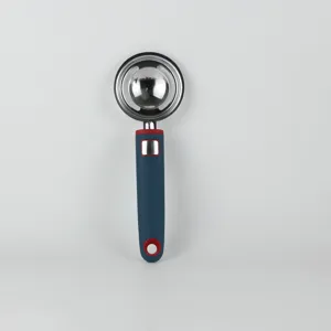 Stainless steel egg separator kitchen tool with silicone handle for baking cooking use.