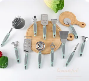 Stainless steel kitchen gadget details, sharp blades, ergonomic grey handles, durable set.