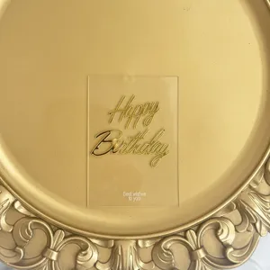 Transparent acrylic happy birthday cake topper with elegant gold text party decoration.