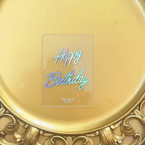 Transparent acrylic happy birthday cake topper detail, holographic text party dessert decoration.