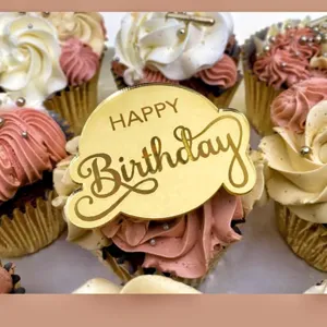 Gold acrylic happy birthday cake topper detail, perfect for birthday party cupcake decoration.