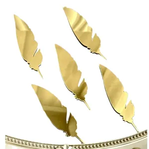 Gold acrylic feather cake toppers set, stylish dessert table decoration for party events.