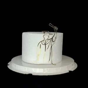 Gold acrylic graduation cake topper, elegant PhD silhouette design for graduation party.