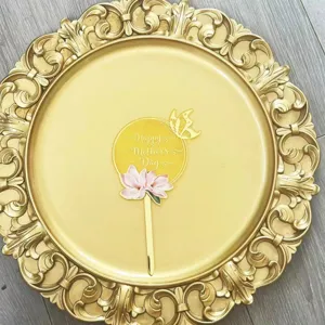 Detailed view of a mother's day acrylic cake topper with floral design for party decor.