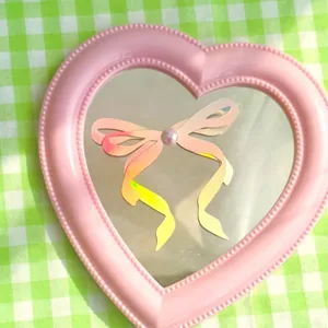 Adorno de tarta con lazo de papel holográfico y estrás, diseño rosa lindo para fiestas.