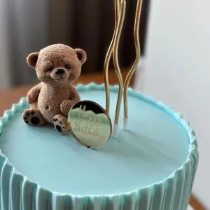 Ins style acrylic happy birthday cake topper set with cute bear figurine and gold candles.