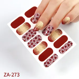 Detailed view of leopard print nail wraps with glitter gradient and wine red solid colors.