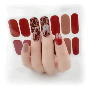 Leopard print nail wraps set, trendy red and brown adhesive nail stickers for stylish manicures.