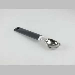 Stainless steel ice cream scoop detail view, ergonomic grey and white handle design.