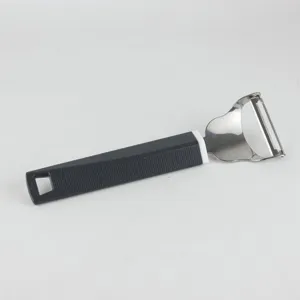 Stainless steel blade fruit peeler with ergonomic non-slip black textured handle detail.