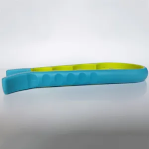 Close-up detail of the multi-functional blue and green kitchen bottle and jar opener tool.