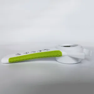 Close-up detail shot of the green and white multi-functional kitchen bottle opener.