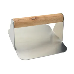Stainless steel burger press with wooden handle for smashed burgers and kitchen cooking tool.
