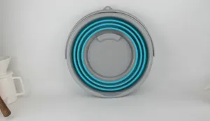 Detailed view of the collapsible foldable bucket, portable design for outdoor fishing or car washing.