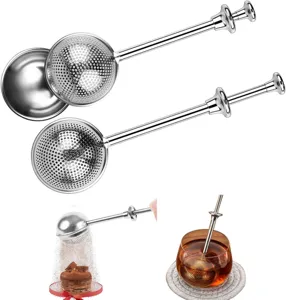 Stainless steel press tea infuser and flour sifter with extendable handle and tray for kitchen.